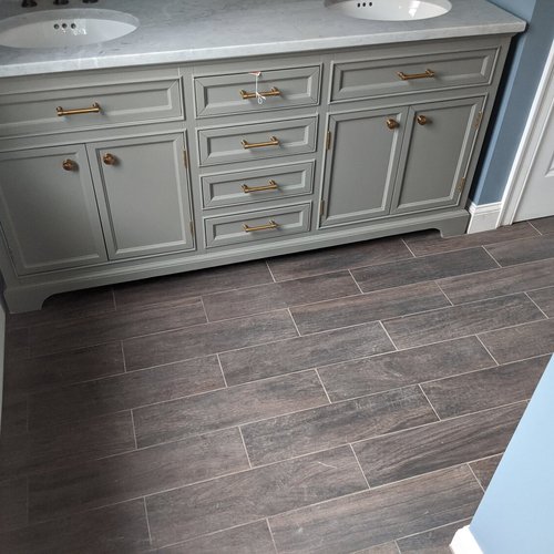 Tile flooring installation by Sunshine Carpet & Flooring in North Chelmsford, MA – porcelain tile in a modern kitchen