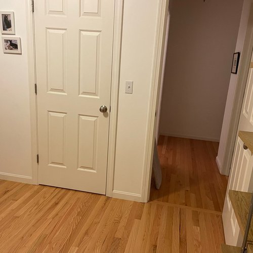 Hardwood flooring installation by Sunshine Carpet & Flooring in North Chelmsford, MA – wide-plank oak in a modern living room