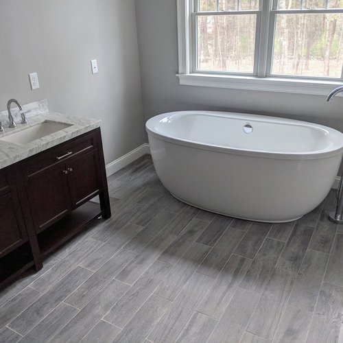 Tile flooring installation by Sunshine Carpet & Flooring in North Chelmsford, MA – porcelain tile in a modern kitchen