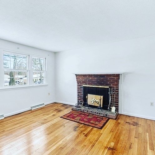 Hardwood flooring installation by Sunshine Carpet & Flooring in North Chelmsford, MA – wide-plank oak in a modern living room