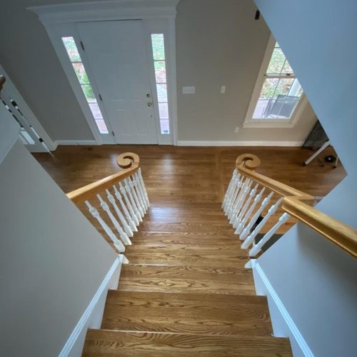 Hardwood flooring installation by Sunshine Carpet & Flooring in North Chelmsford, MA – wide-plank oak in a modern living room