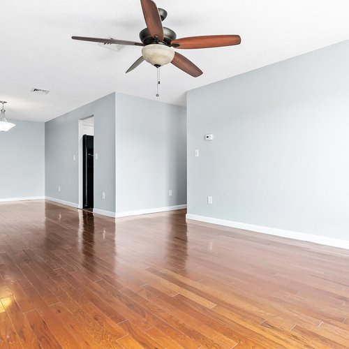 Hardwood flooring installation by Sunshine Carpet & Flooring in North Chelmsford, MA – wide-plank oak in a modern living room