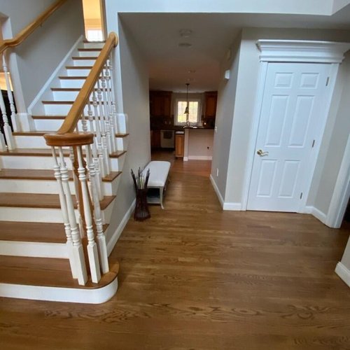 Hardwood flooring installation by Sunshine Carpet & Flooring in North Chelmsford, MA – wide-plank oak in a modern living room