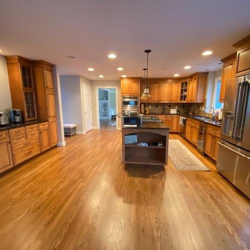 Hardwood flooring installation by Sunshine Carpet & Flooring in North Chelmsford, MA – wide-plank oak in a modern living room