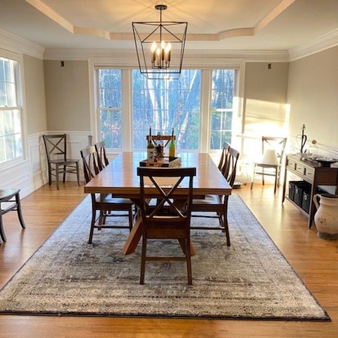Hardwood flooring installation by Sunshine Carpet & Flooring in North Chelmsford, MA – wide-plank oak in a modern living room