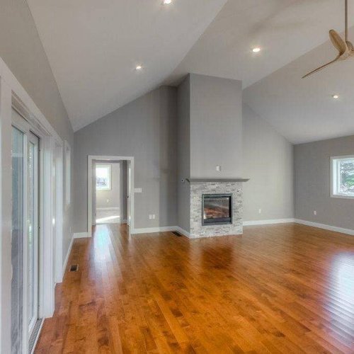 Hardwood flooring installation by Sunshine Carpet & Flooring in North Chelmsford, MA – wide-plank oak in a modern living room