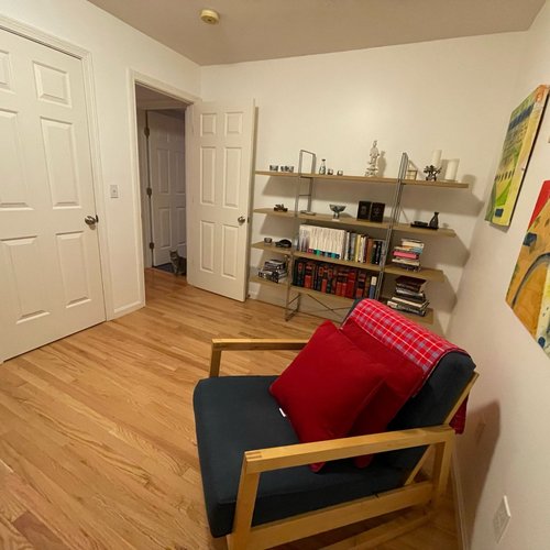 Hardwood flooring installation by Sunshine Carpet & Flooring in North Chelmsford, MA – wide-plank oak in a modern living room